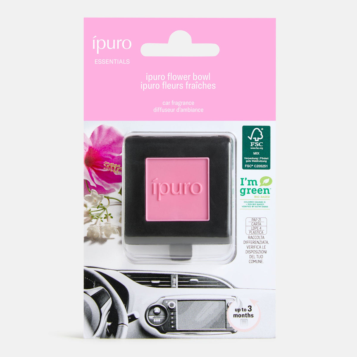 Der ipuro Autoduft Flower Bowl Auto-Duftzerstäuber in Pink zeigt sich in seiner umweltfreundlichen Verpackung mit Blumengrafik, einem Bild des Armaturenbretts, "belebende Frische" und bis zu 3 Monaten Duft von ipuro.
